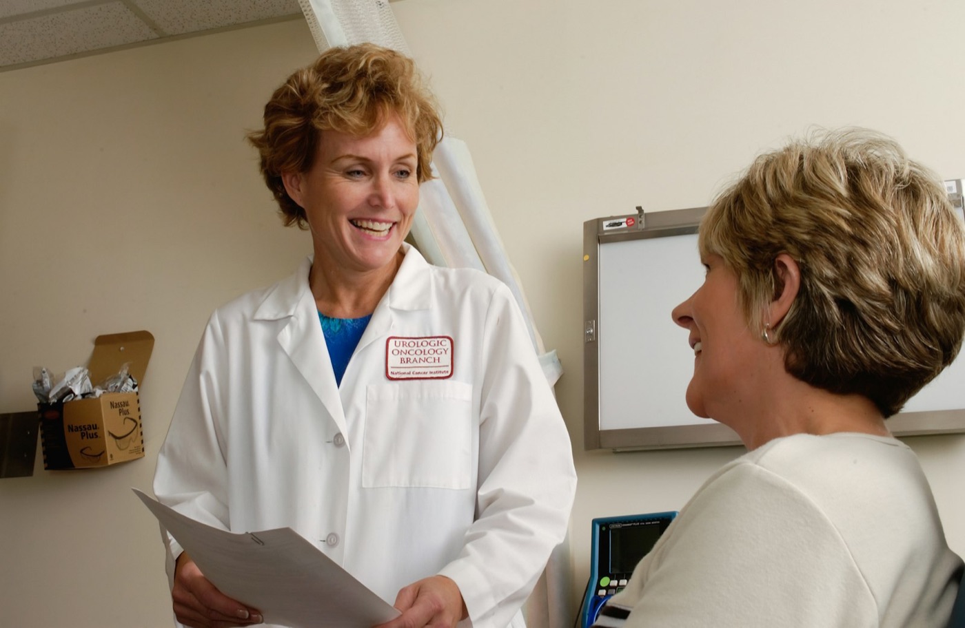 A doctor talks a patient through her options in a consultation room